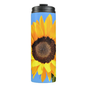 Termo Girasol amarillo contra el sol en el cielo azul - 
