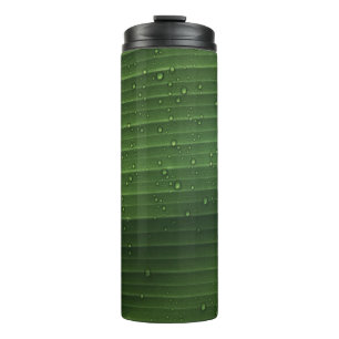 Termo Gotas de agua en hojas verdes