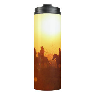 Termo La silueta del jinete como vestuario de vaquero co