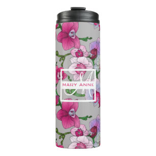 Termo Las orquídeas rosadas en la floración el   añad