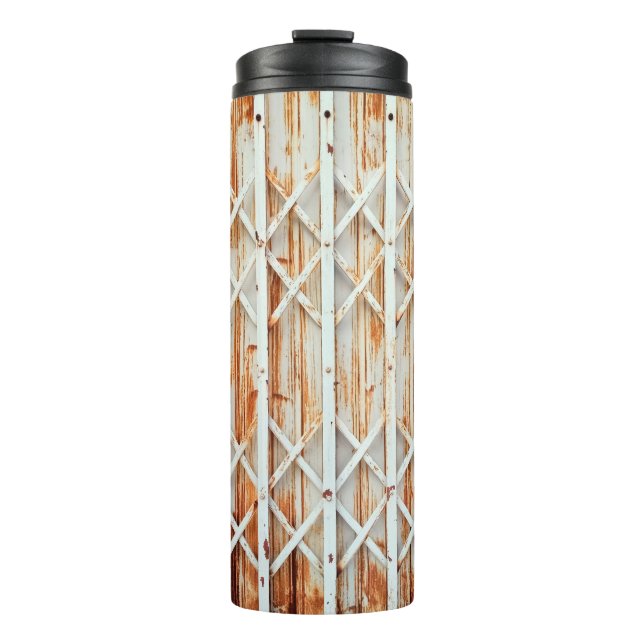 Termo Los paneles antiguos de la puerta de hierro están  (Anverso)