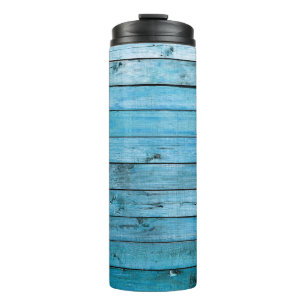 Termo Madera natural azul, fondo texturado.