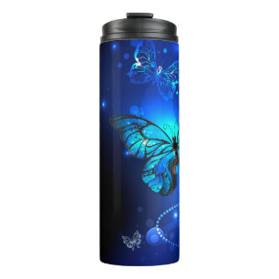 Termo Mariposa morfo en el fondo oscuro