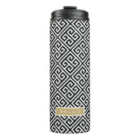 Monograma de clave griega negra y dorada