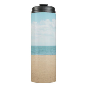 Termo Palmera artificial verde a orillas del mar