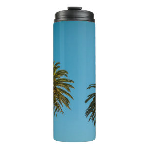 Termo Palmera verde bajo cielo azul por la mañana