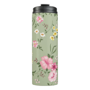 Termo Patrón de flores vintage sin foco sobre fondo verd