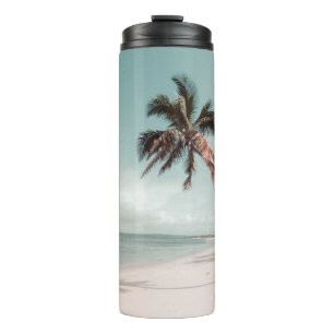 Termo Playa junto a la palmera de coco