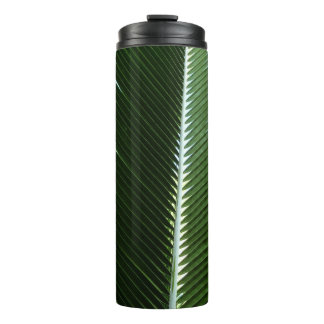 Termo Resumen verde tropical de palmeras que se abruman