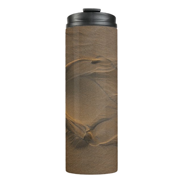 Termo Selective focus photography of sand (Anverso)