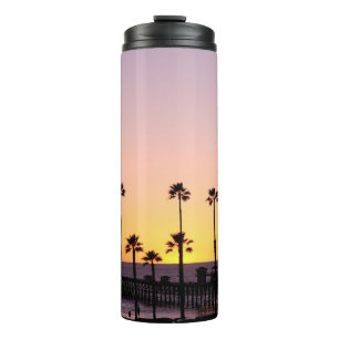 Termo Silhouette de palmeras y muelle al atardecer