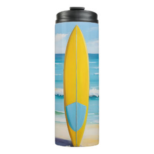 Termo Tablón de surf azul y amarillo en la playa