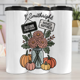Termo Un mercado de flores y calabaza otoñales