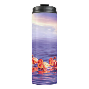 Termo Una bandada de hermosos flamencos rosados contra u