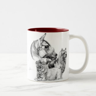 Terrieres de Norwich y taza del caballo