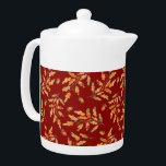 Tetera Colores otoñales de hojas y maíz<br><div class="desc">La tetera elegante presenta ilustraciones acuarelas de hojas de color otoñal y bellotas sobre fondo rojo oscuro</div>