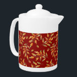 Tetera Colores otoñales de hojas y maíz<br><div class="desc">La tetera elegante presenta ilustraciones acuarelas de hojas de color otoñal y bellotas sobre fondo rojo oscuro</div>