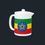 Tetera con bandera de Etiopía<br><div class="desc">Esta Tetera con Bandera de Etiopía combina la funcionalidad con el orgullo nacional, ofreciendo una hermosa manera de servir su té favorito mientras se celebran los vivos colores y simbolismo de la bandera etíope. La tetera presenta los icónicos colores verde, amarillo y rojo de la bandera, junto con el círculo...</div>