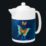 Tetera Mariposas doradas sobre fondo azul<br><div class="desc">Oro volador,  mariposa de joyas sobre fondo textural azul. Diseño con mariposas.</div>