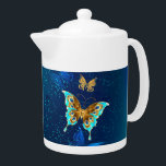 Tetera Mariposas doradas sobre fondo azul<br><div class="desc">Oro volador,  mariposa de joyas sobre fondo textural azul. Diseño con mariposas.</div>
