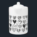 Tetera Patrón de gato y corazón negro y blanco<br><div class="desc">Gato juguetón colgando en un globo con forma de corazón rodeado de diferentes corazones con estampado en blanco y negro.</div>