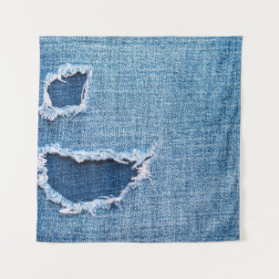 Textura de tela de denim desgarrada, tonos azules.