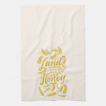 Tierra que fluye con leche y toalla de té de miel