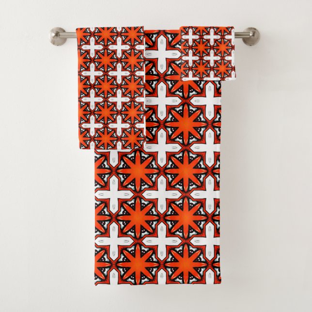 Toalla con patrón geométrico rojo y naranja (In situ)