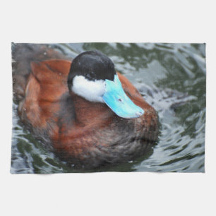 Toalla de cocina cargada en cuenta azul del pato