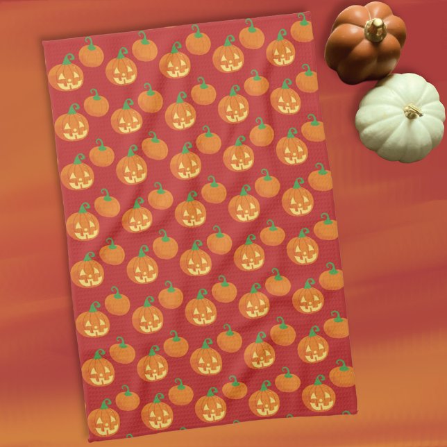 Toalla de cocina con estampado de calabaza Jack-o- (Cute Halloween kitchen towel with a Jack-o-Lantern and pumpkin pattern .)