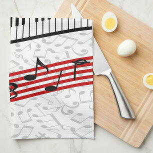 Toalla de cocina roja con puntuación de piano y mú