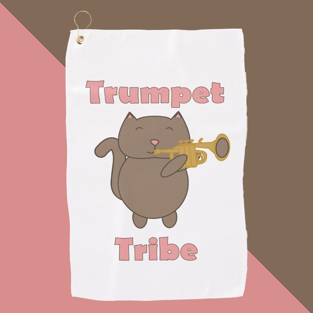 Toalla De Golf Trumpet Tribe Kawaii Cat Pink (A golf towel with a brown cat playing trumpet and the words trumpet tribe in pink.)
