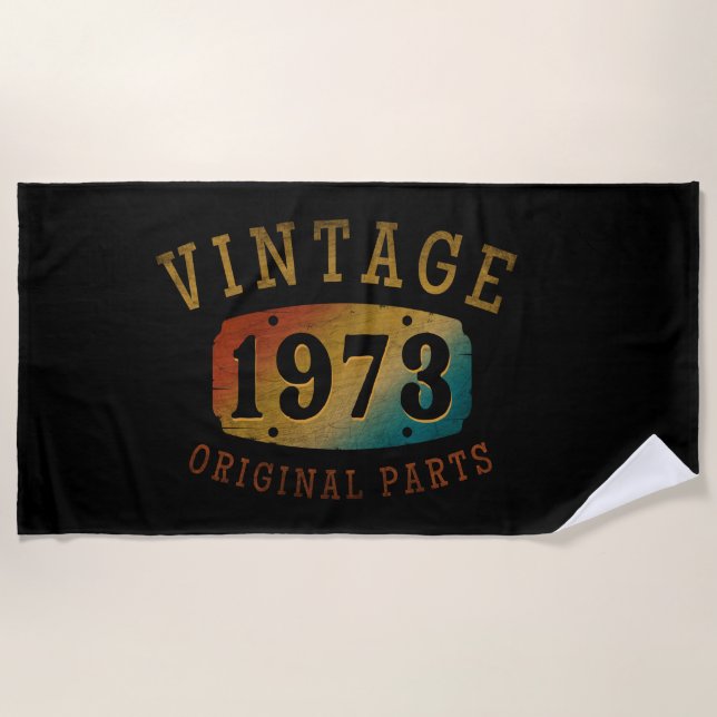 TOALLA DE PLAYA ANTIGÜEDADES 1973 PIEZAS ORIGINALES (Anverso)