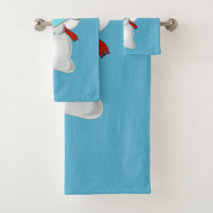 Toallas de baño azules con graciosa muñeca de niev