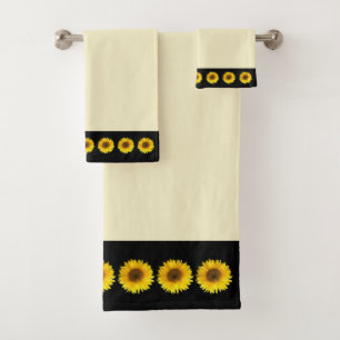 Toallas de baño con girasoles sobre marfil y negro