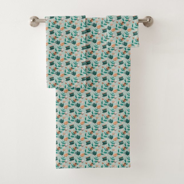 Towels with a teal floral pattern hang  (Subido por el creador)