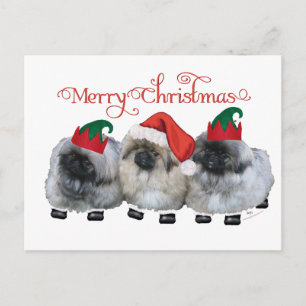 Tres cachorros de Pekín en Navidad