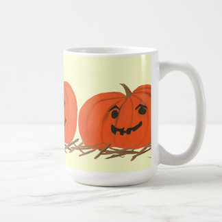 Tres calabazas felices en tazas de Hay Halloween