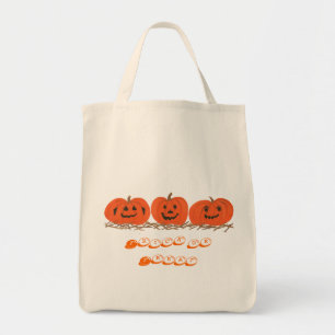 Tres calabazas sentadas en la paja, bolsa de Hallo