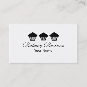 Tres cupcakes negras a favor de las tarjetas de vi