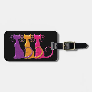 Tres etiquetas del equipaje de los gatos