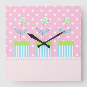 Tres flores en rosa con el reloj cuadrado de los