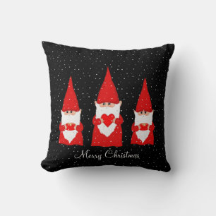 Tres gnomos de Navidad en cojín decorativo negro