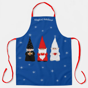 Tres gnomos de Navidad en delantal azul real