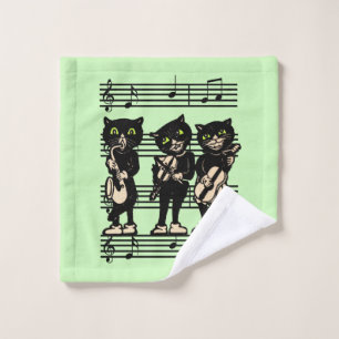 Tres músicos de gato negro hojas de notas verdes