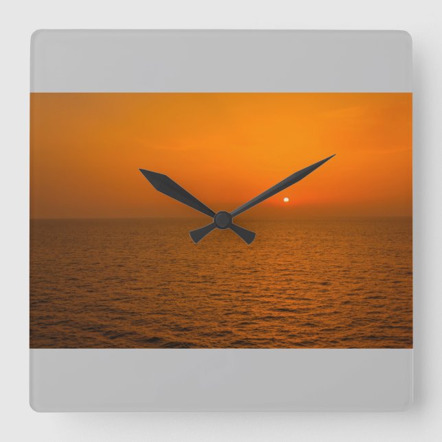 Un atardecer en el mar en reloj de pared (Anverso)