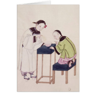 Un chica que busca suerte en un cuenco de agua