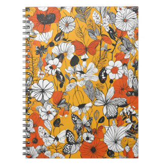 Un cuaderno con arte botánico y de mariposas