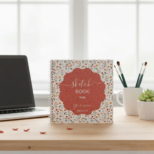 Un cuaderno de dibujo diseñado con diseños florale