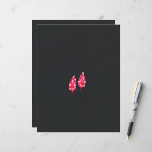 un par de hojas rojas sobre un fondo negro